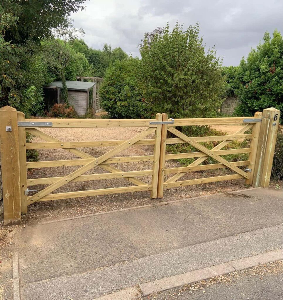 This is a photo of a wooden driveway gate installed by Fast Fix Fencing Haverhill